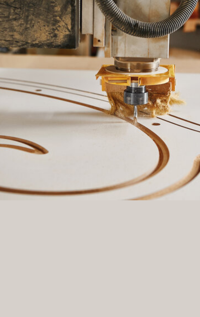 CNC drill cutting shapes in wood