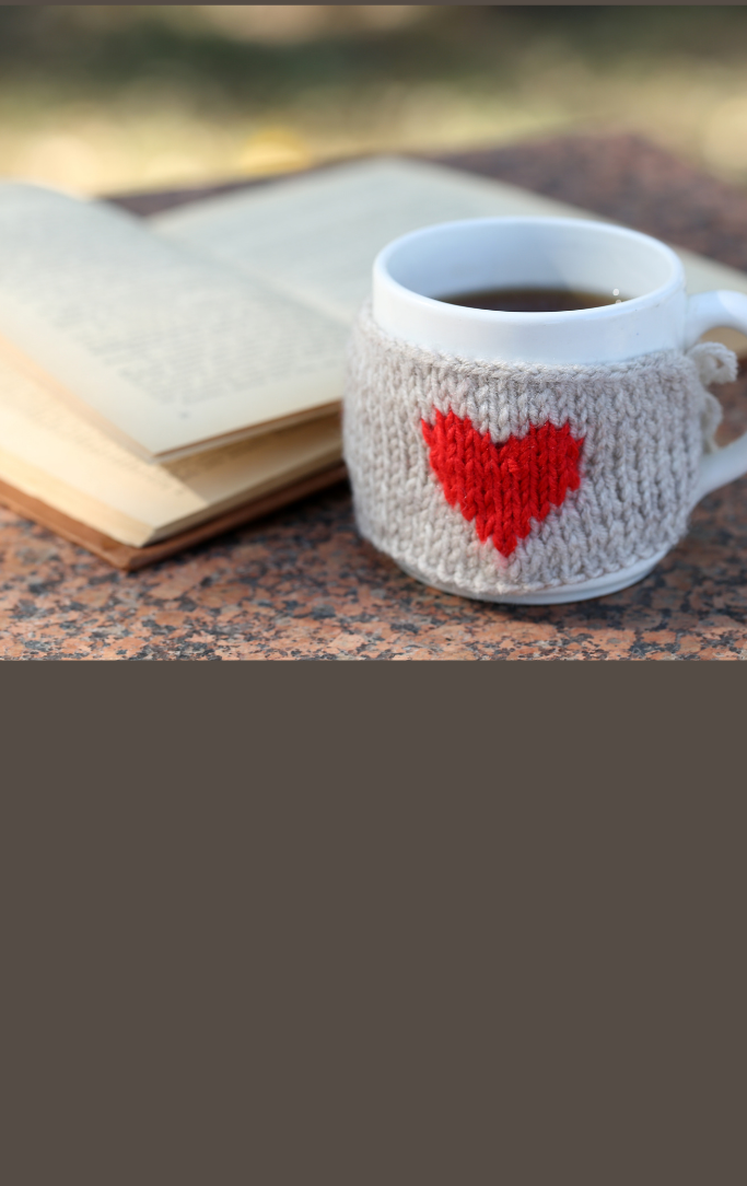 books and coffee mug with a heart