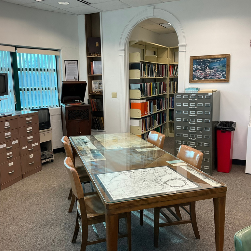 interior image of the Ada Pressman room of a partially covered with maps