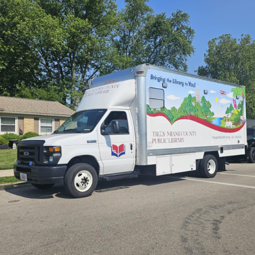 Bookmobile parked in a neighborhood