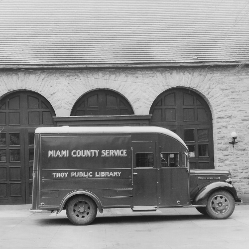 black and white image of the old bookmobile park outside the Hayner Center.