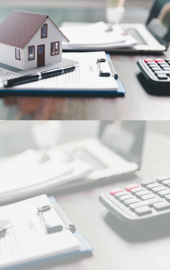 Image of a home with a calculator and paperwork